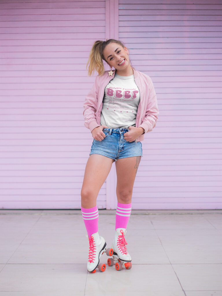 young lady wearing a 100% female BEEF t-shirt with roller skates on